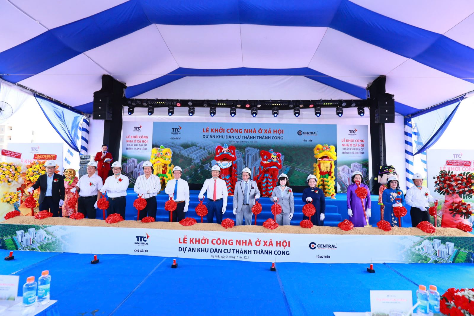 A group of people standing on a stageAI-generated content may be incorrect.